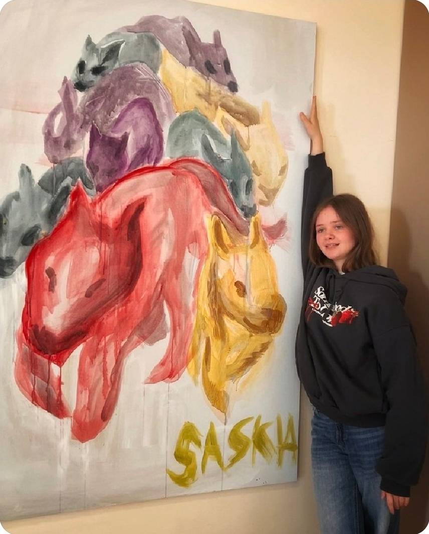 Saskia Buhr stands next to her painting. Saguramo 2024